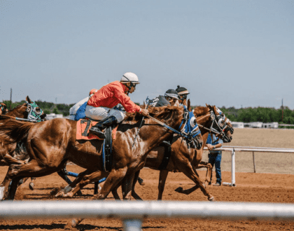 Men riding horses during a race