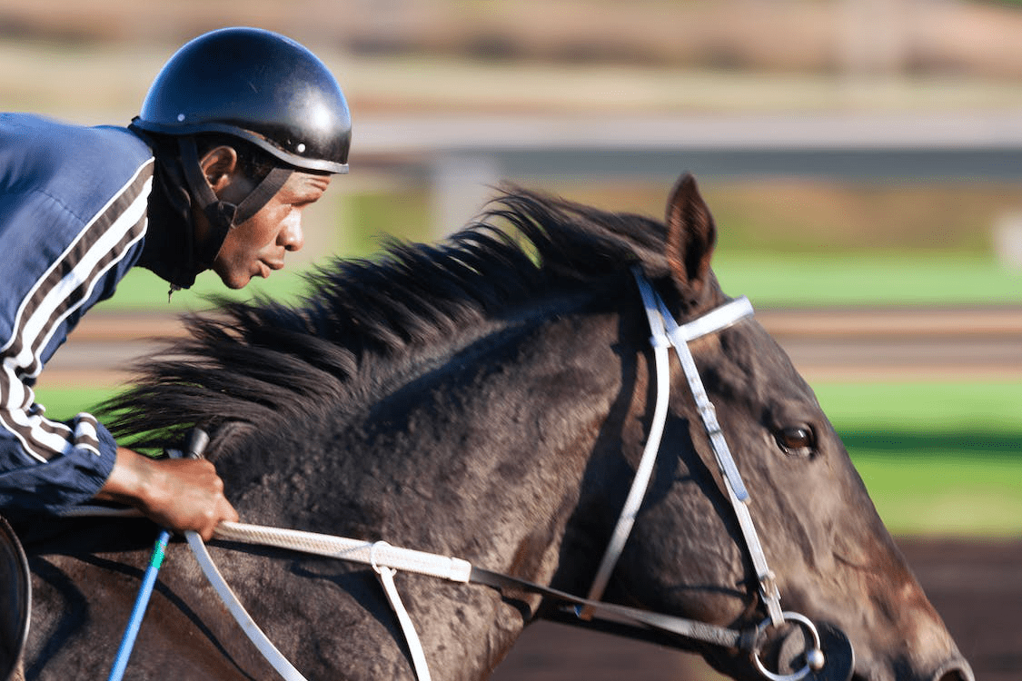 A man riding a horse in a race